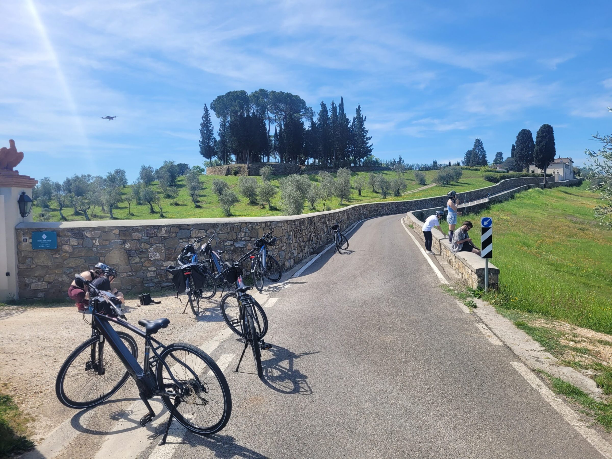 a person riding a bicycle on a dirt road