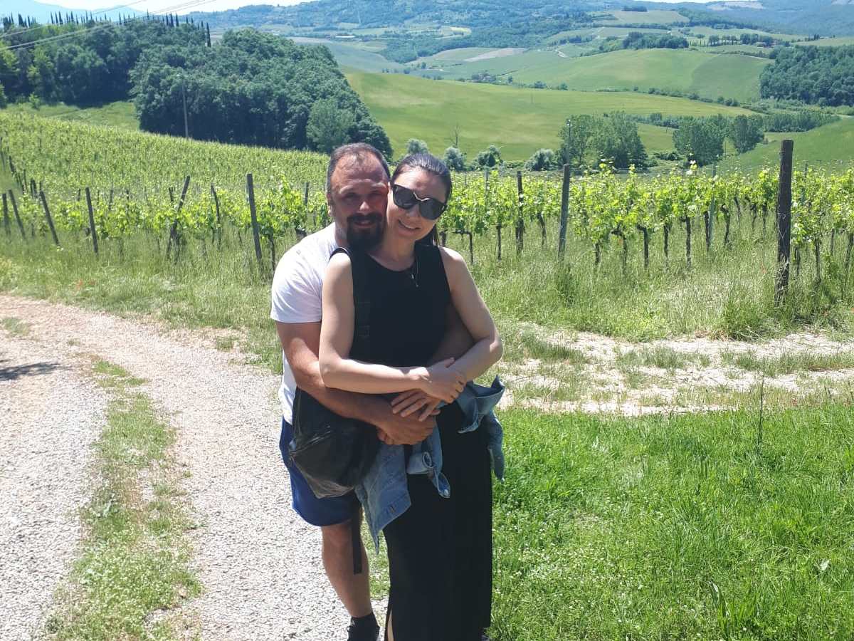 a man that is standing in the grass