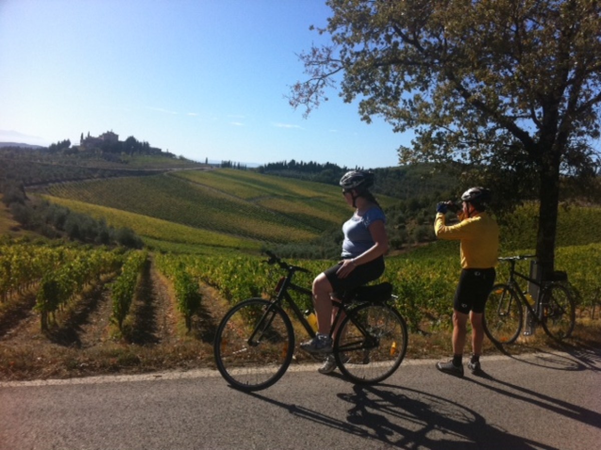 a person riding a bike down a dirt road