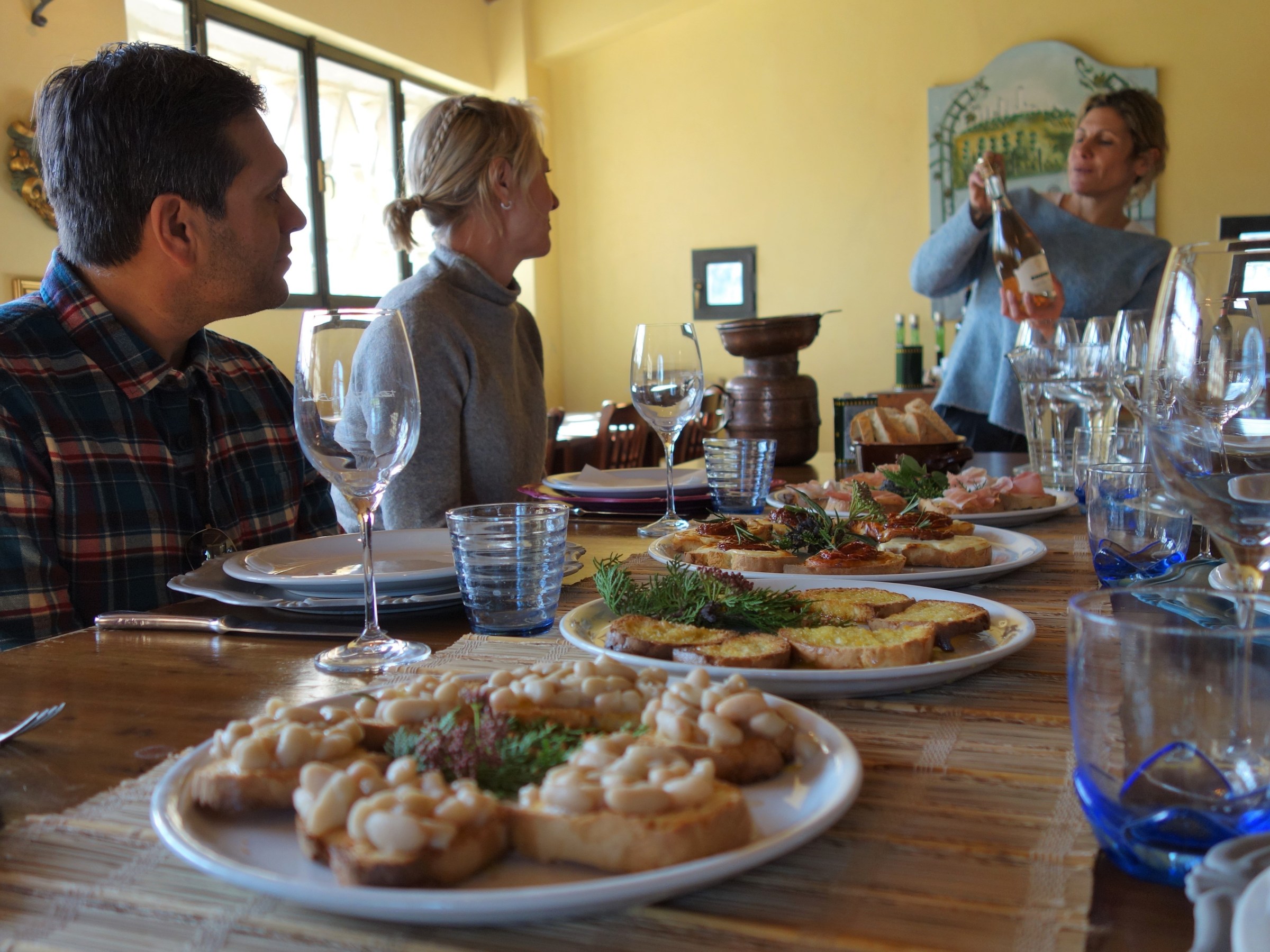 a man sitting at a table with a plate of food