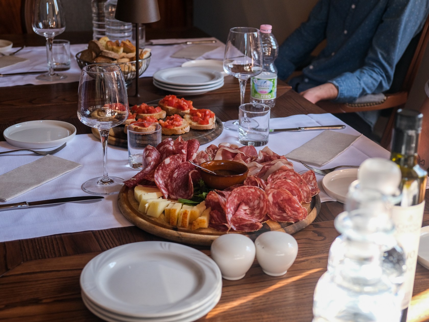 a group of people sitting at a table with a plate of food