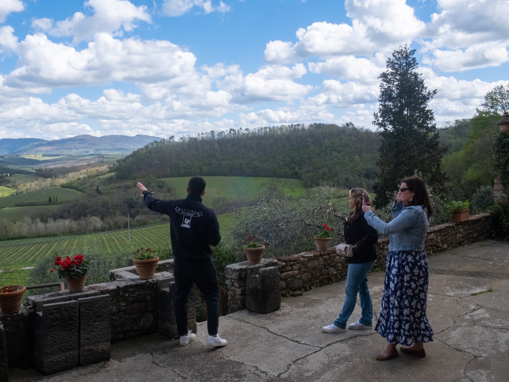a group of people standing on top of a mountain