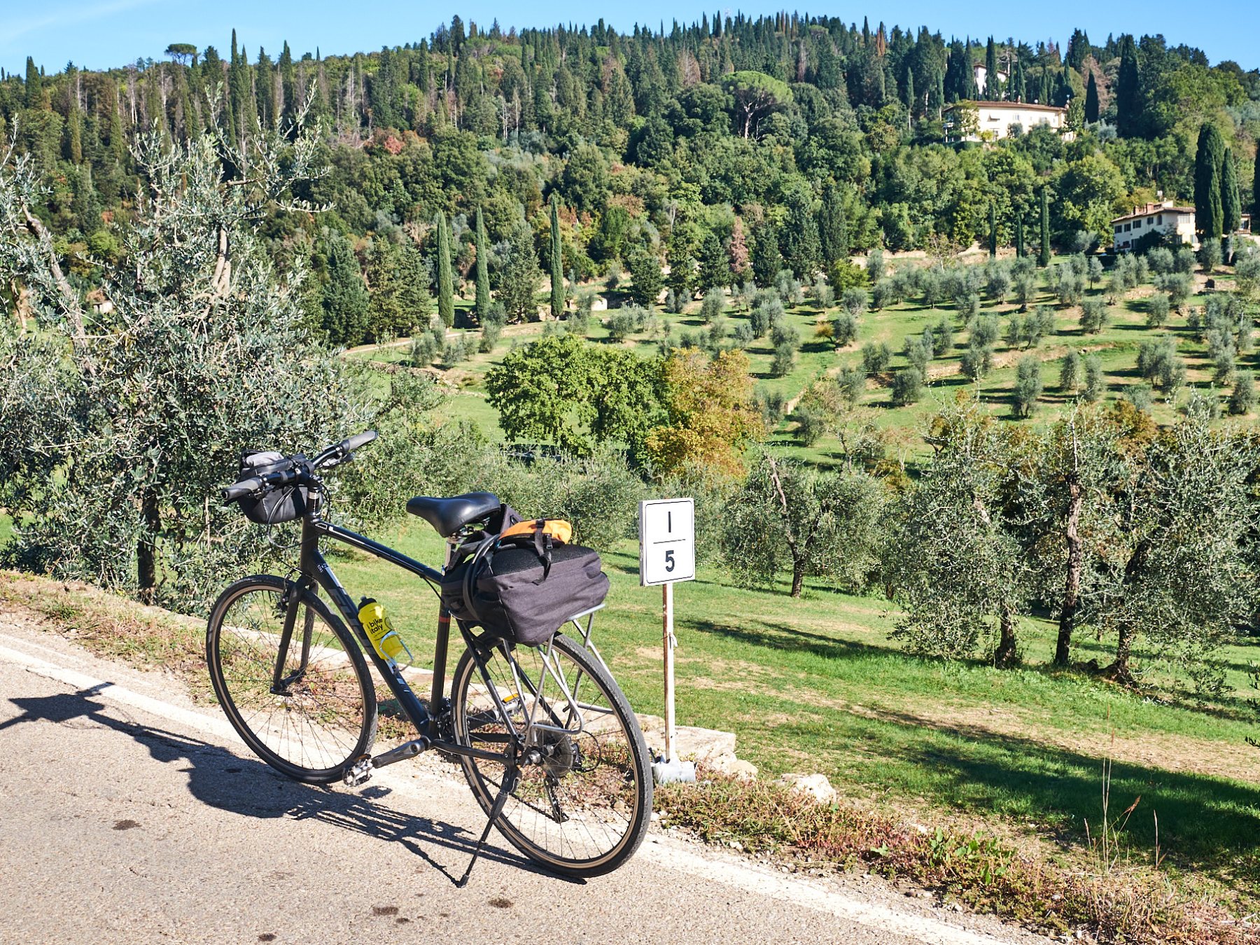 a bicycle parked on the side of the road