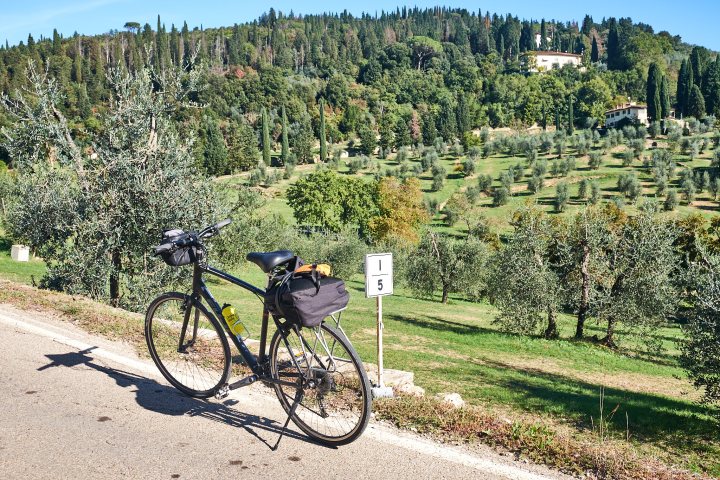 a bicycle parked on the side of the road