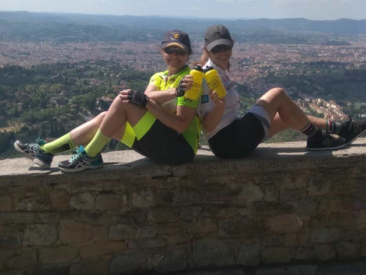 a person sitting on the side of a mountain