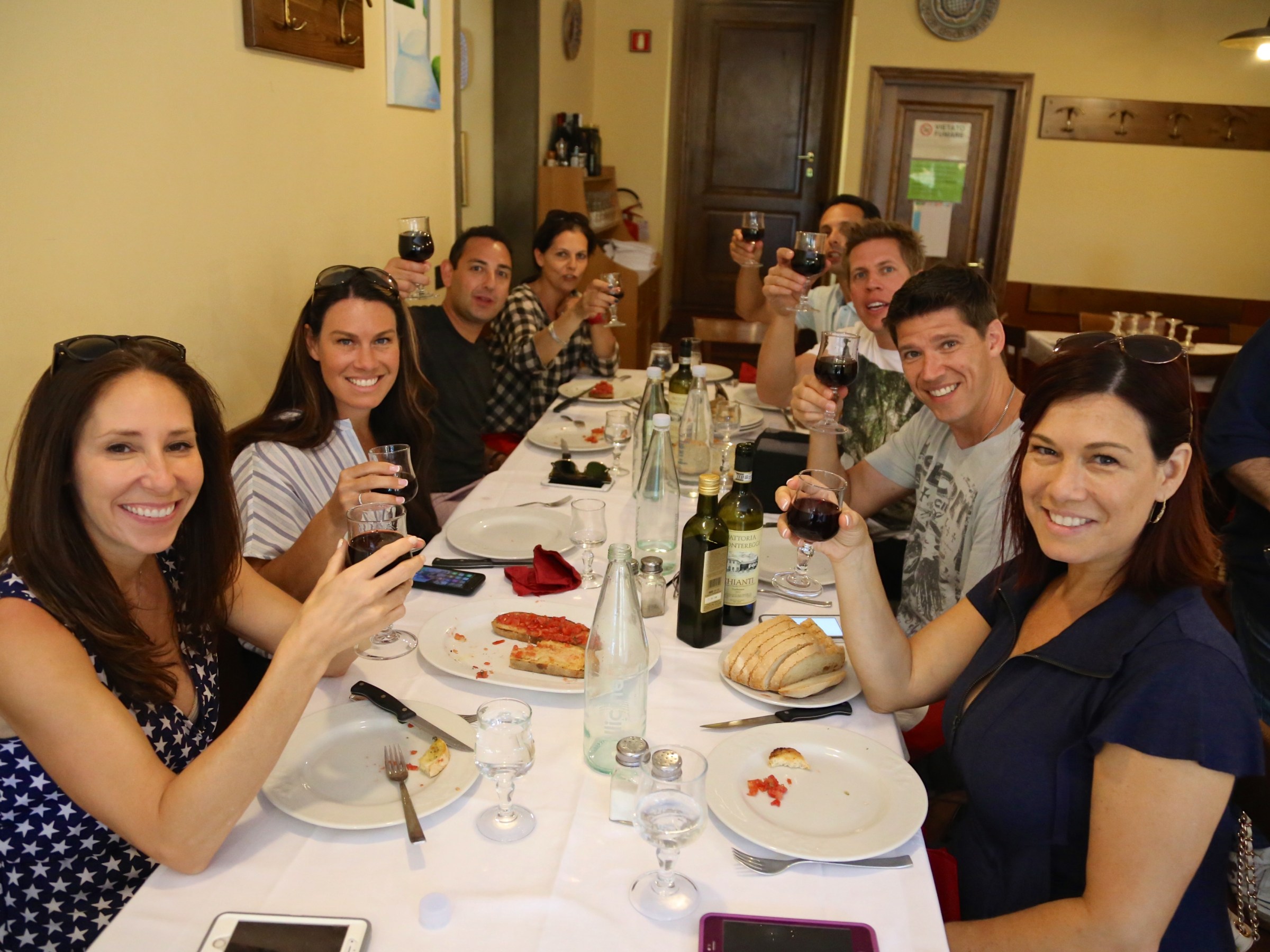 Crys Wiltshire et al. sitting at a dinner table posing for the camera