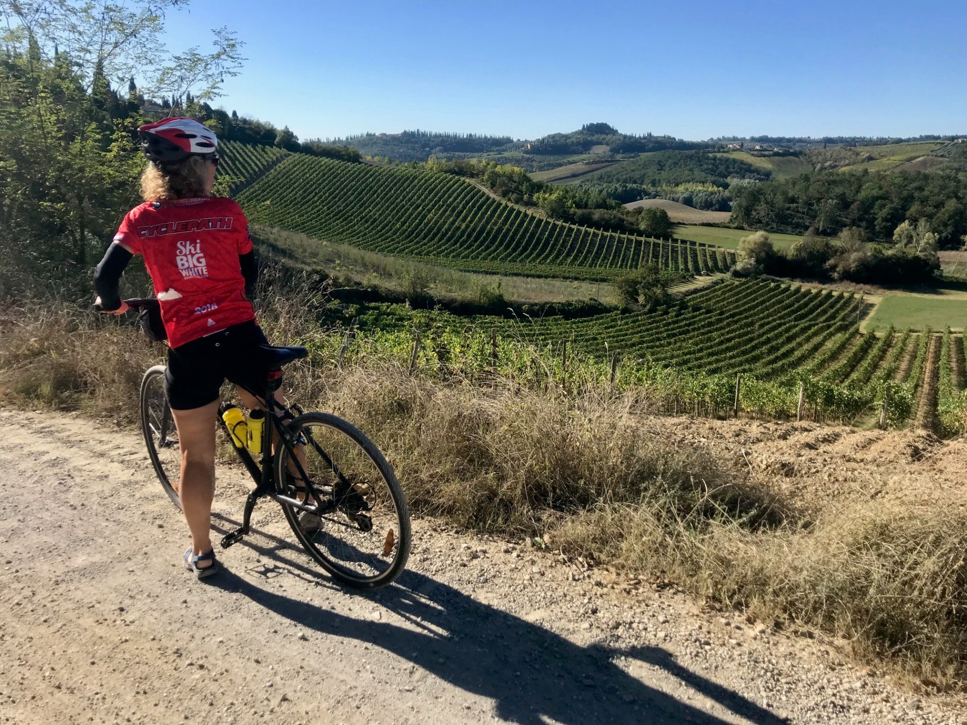 Bike rider in a tuscan field in Francigena trail