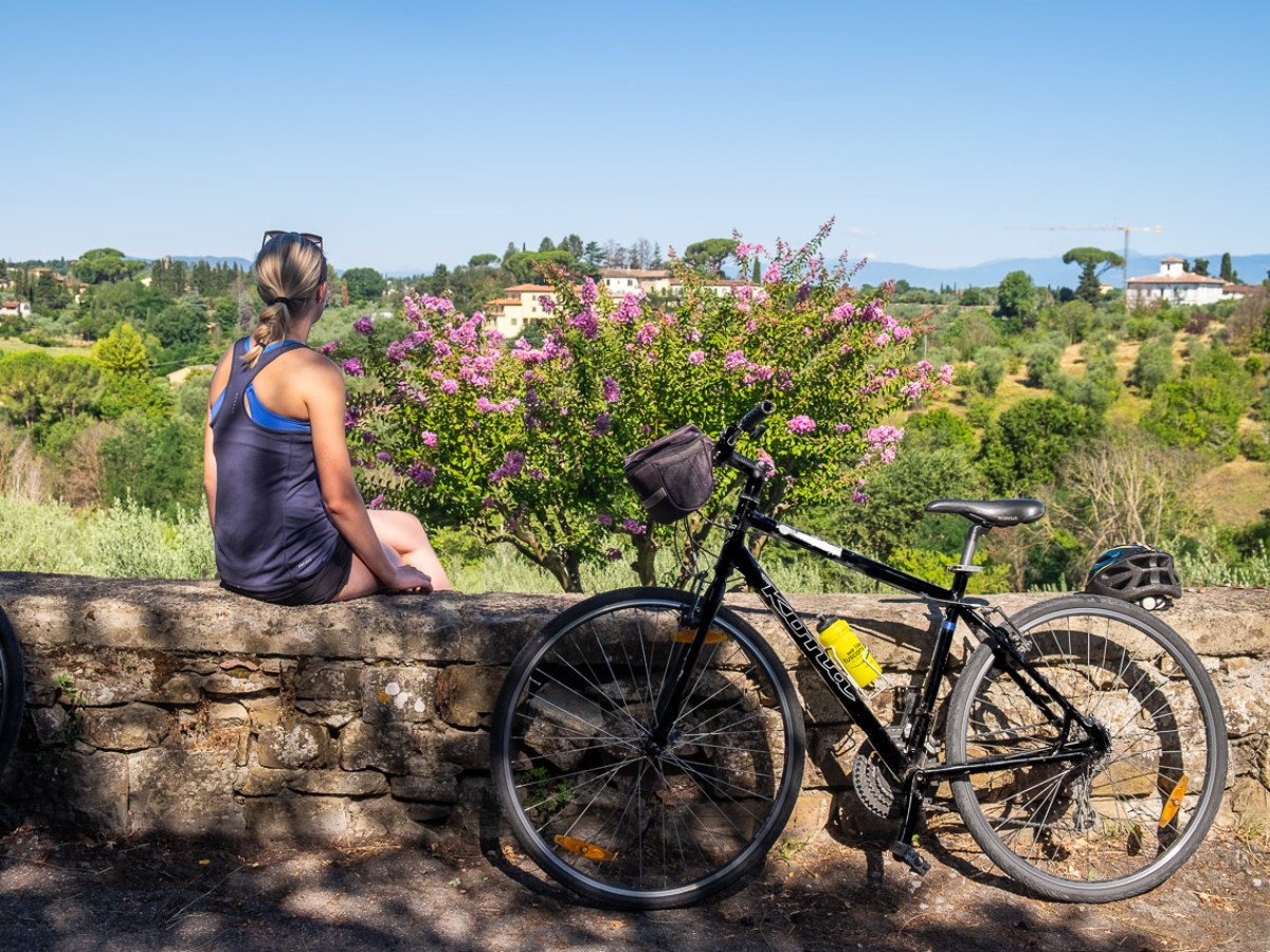 Person looking at great views on the Chianti Shire next to bike