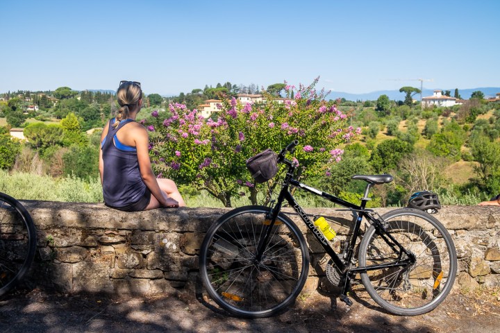 Person looking at great views on the Chianti Shire next to bike