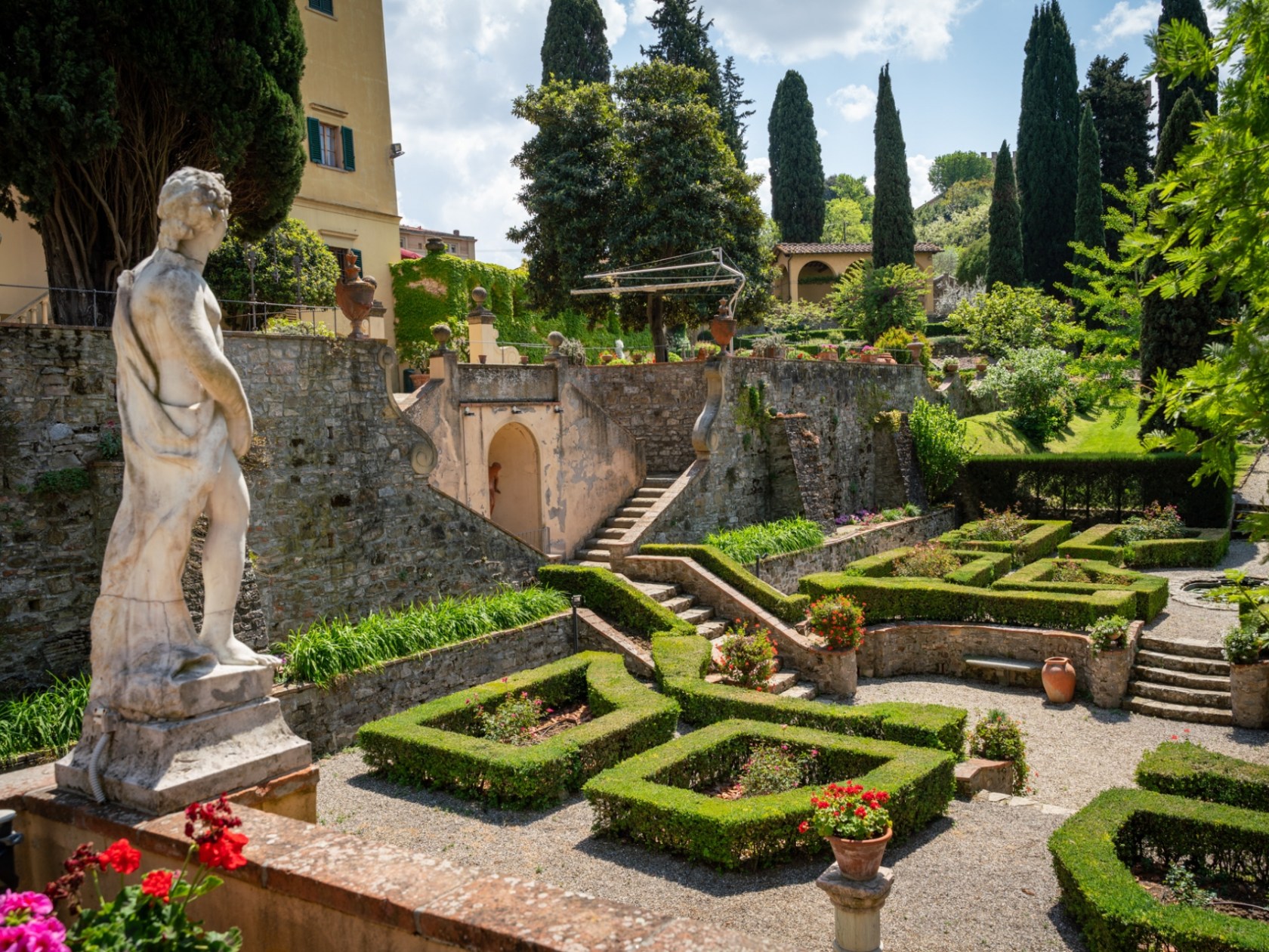 a statue of a person in a garden