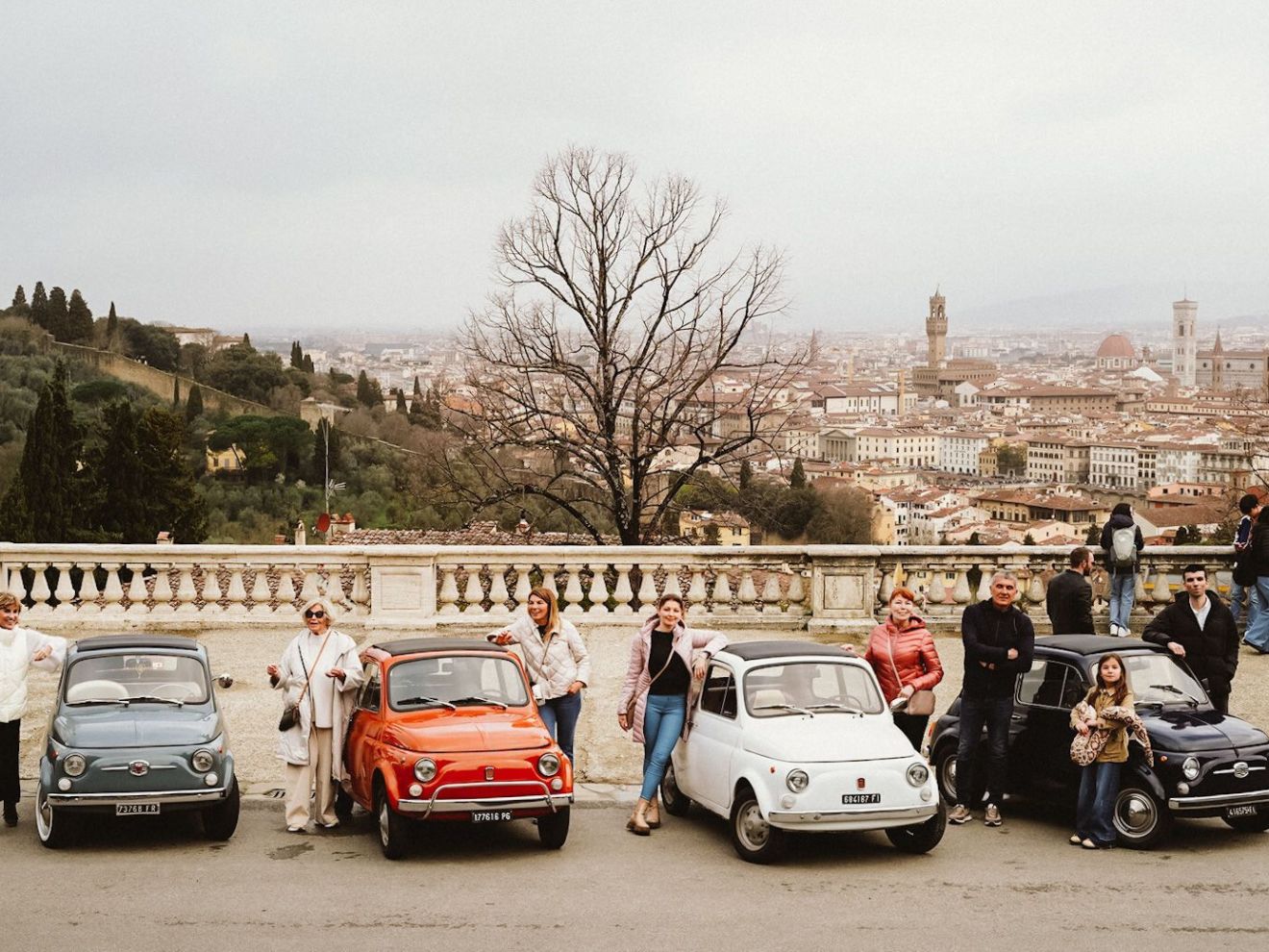 a group of people in a car parked in a parking lot