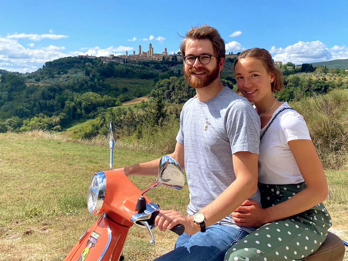 a man sitting on a bench posing for the camera