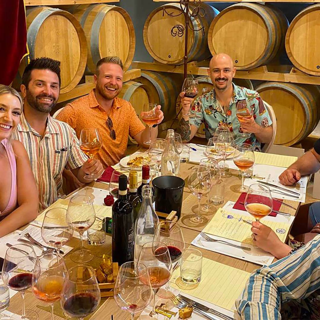 a group of people sitting at a table posing for the camera