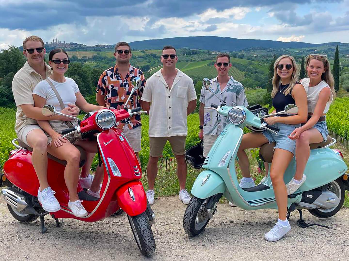 a group of people sitting on a motorcycle