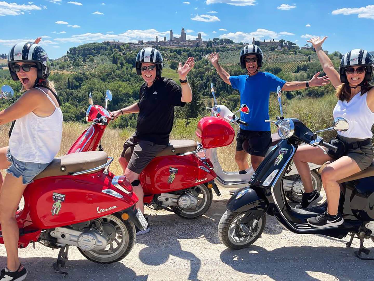 a group of people riding on the back of a motorcycle