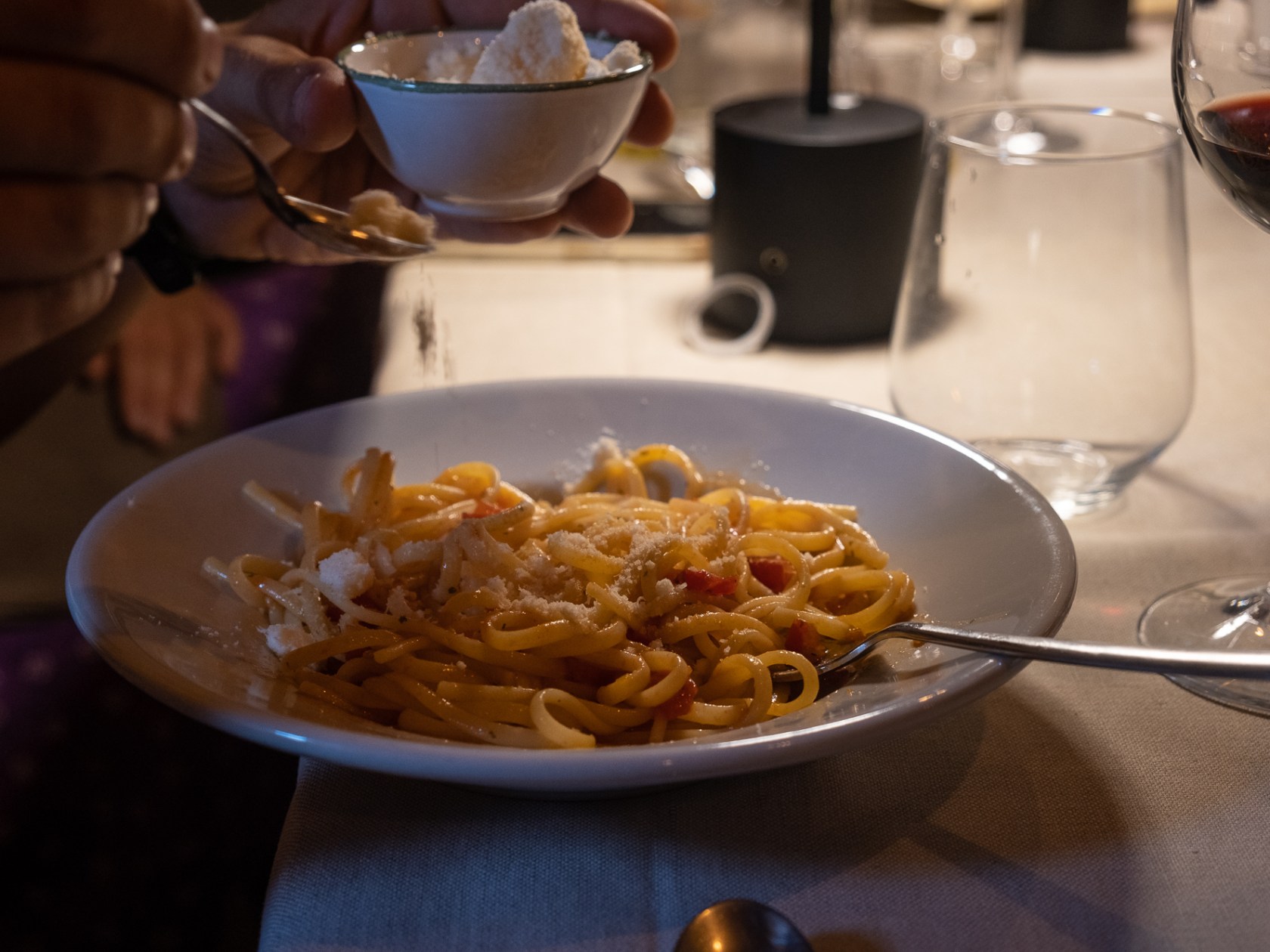 a plate of food and a glass of wine