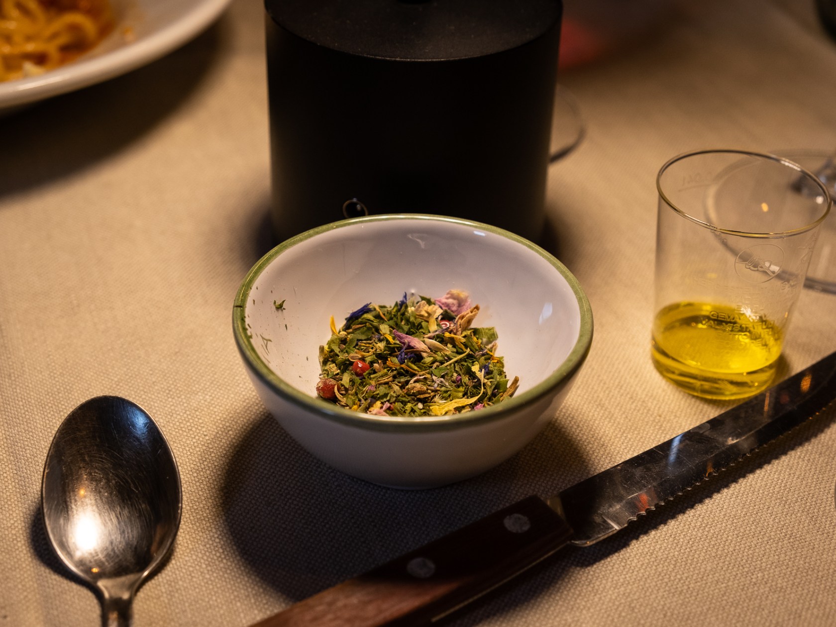 a bowl of food sitting on a table