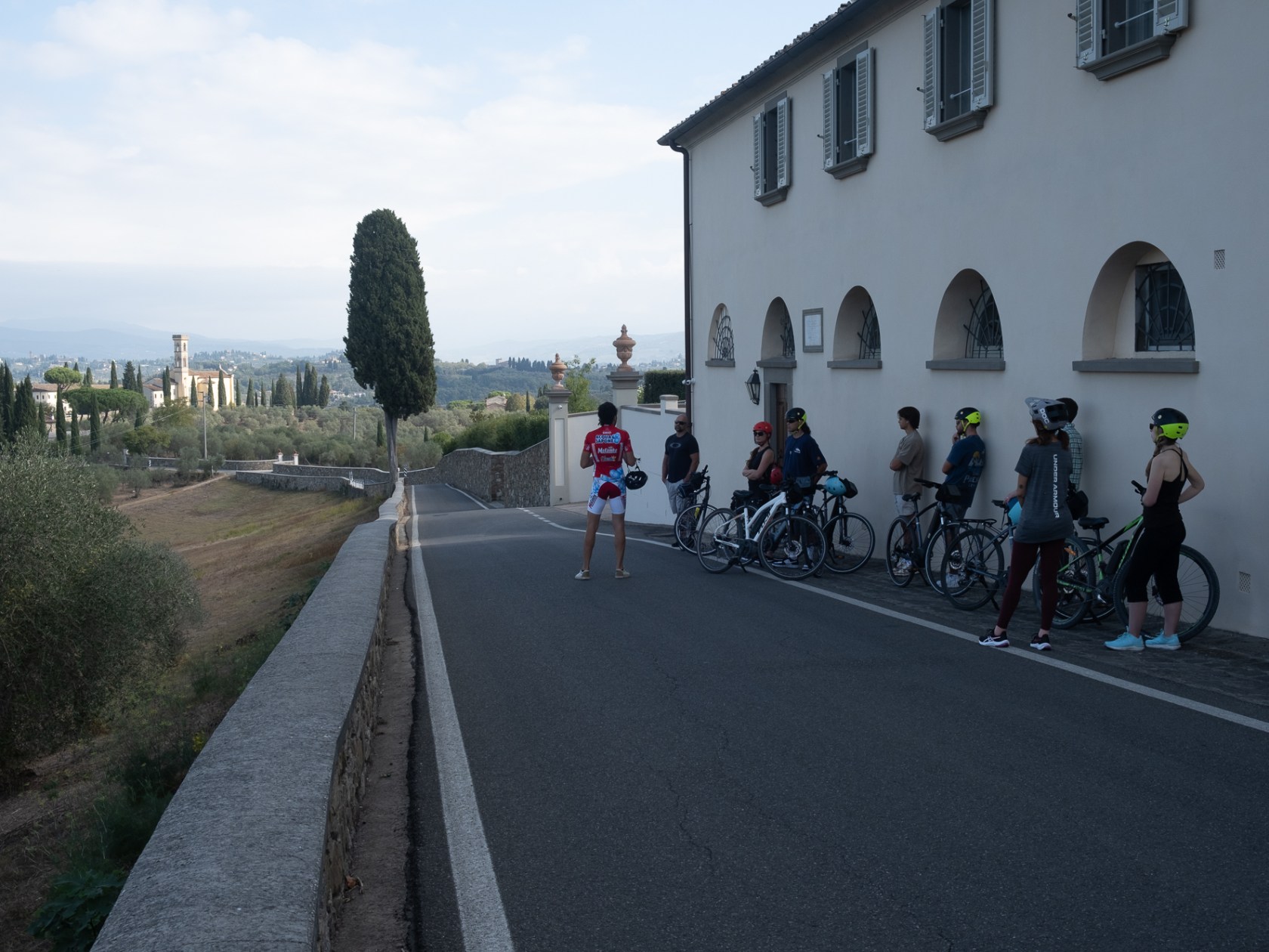 a group of people riding on the back of a bicycle