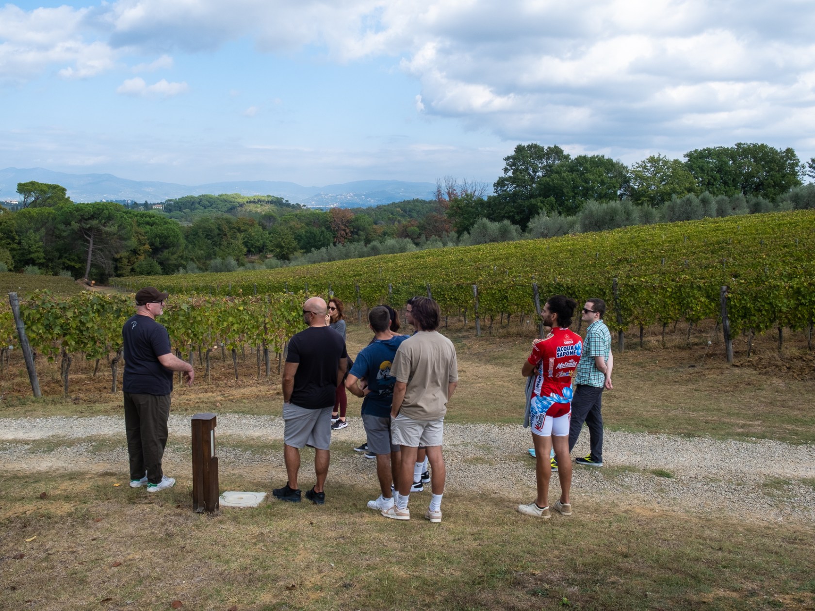 a group of people standing in a field