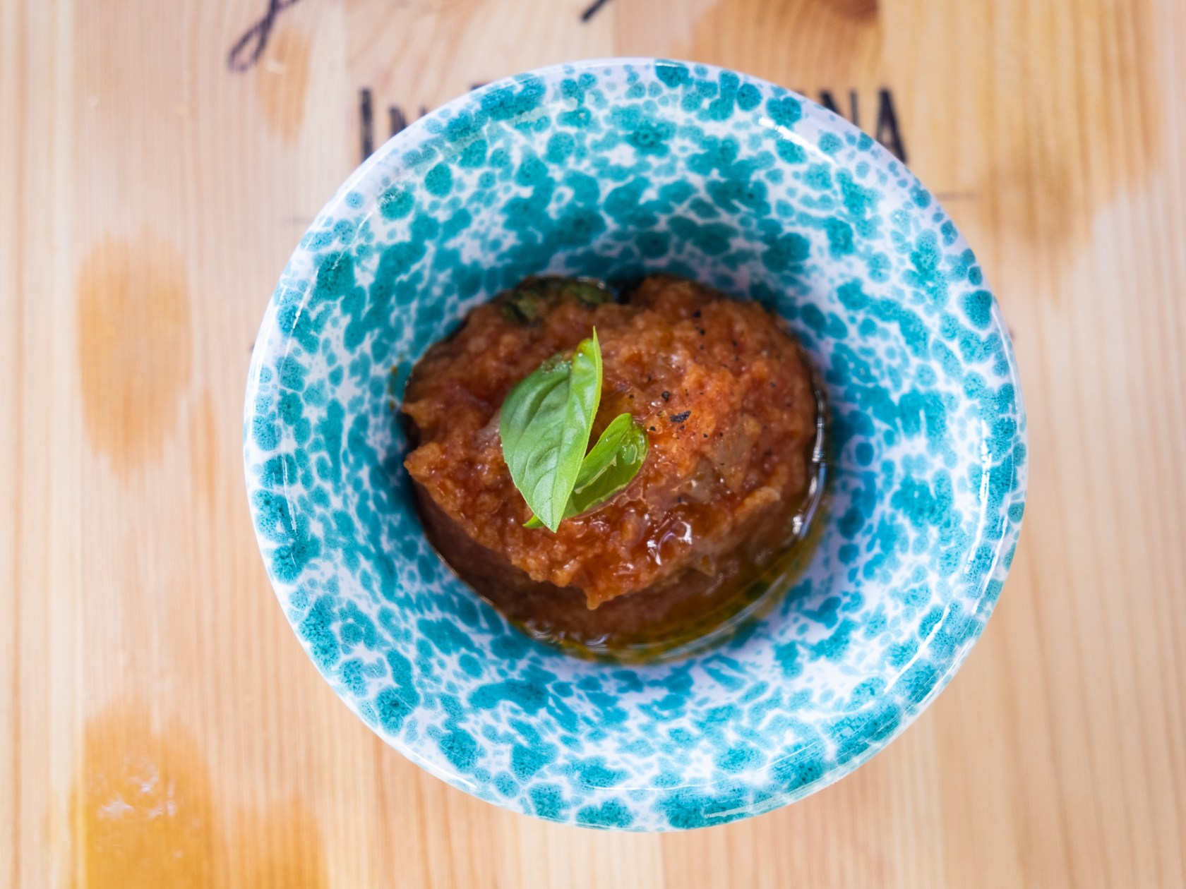 a donut sitting on top of a wooden table
