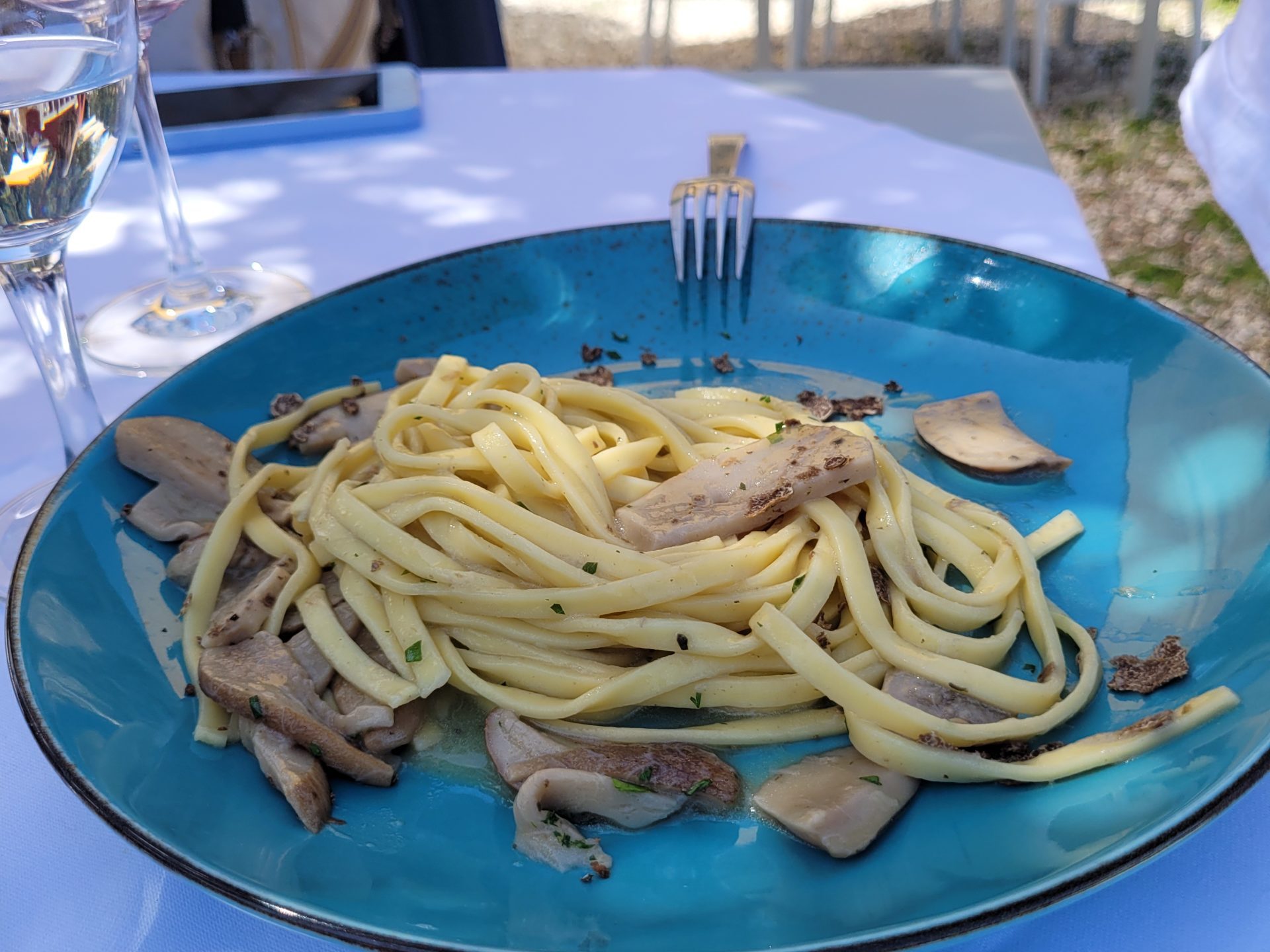 a plate of food with pasta on a table