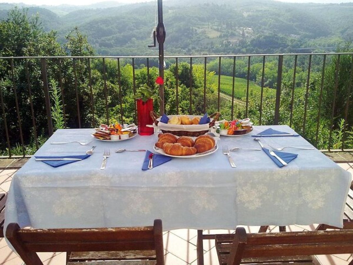 a wooden bench sitting in front of a picnic table