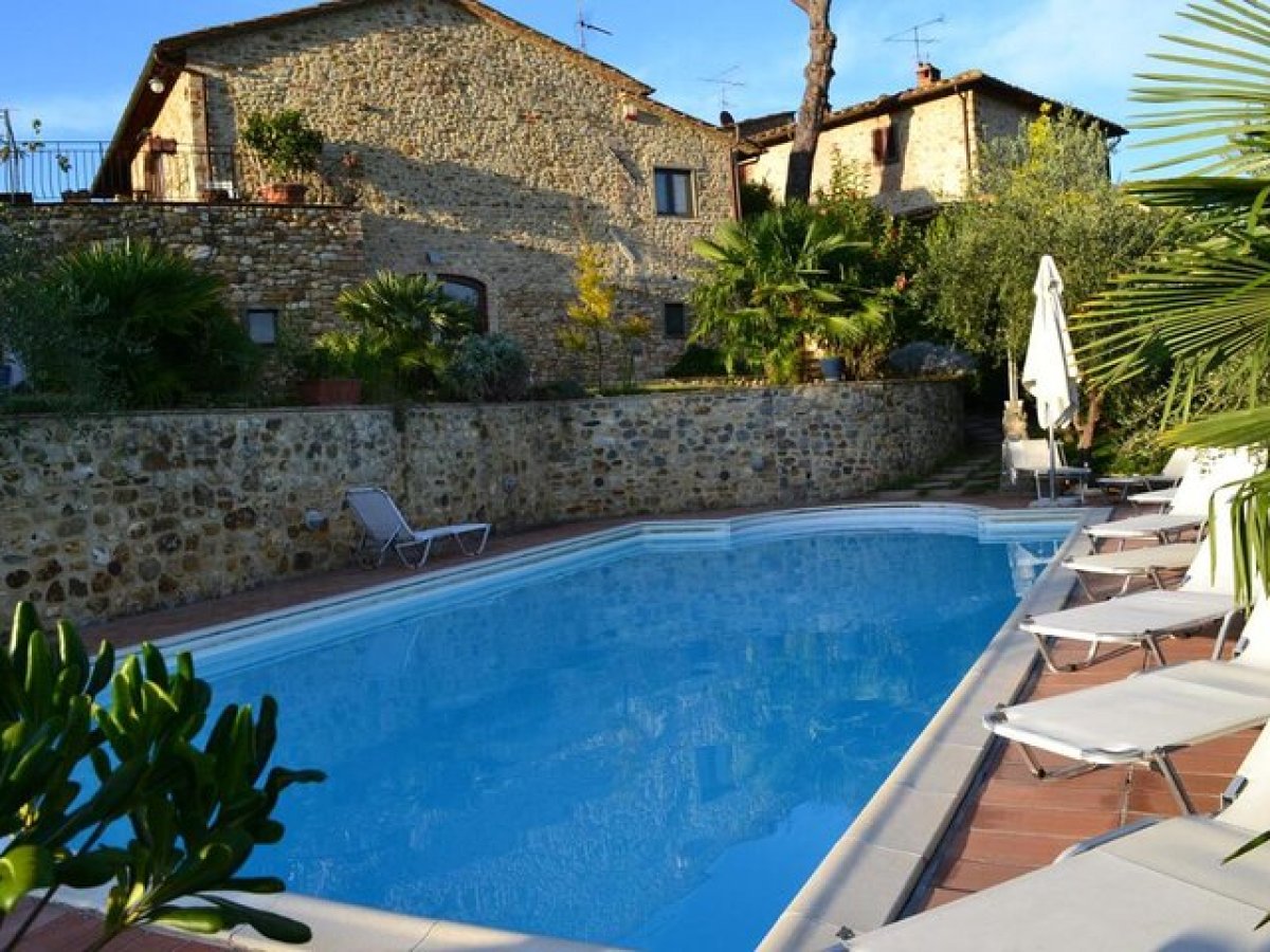 a building with a pool in a garden