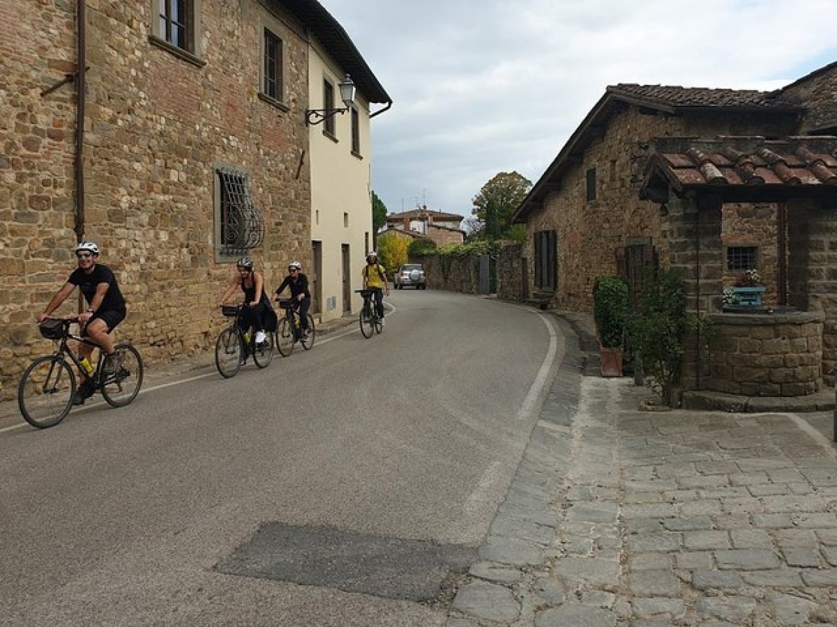 a person riding a bicycle on a brick building