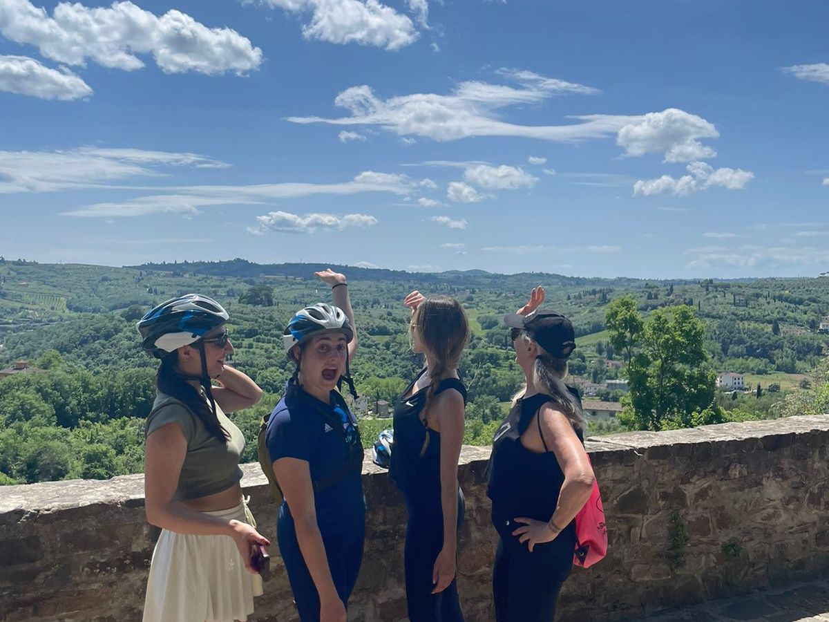 a group of people standing on top of a mountain