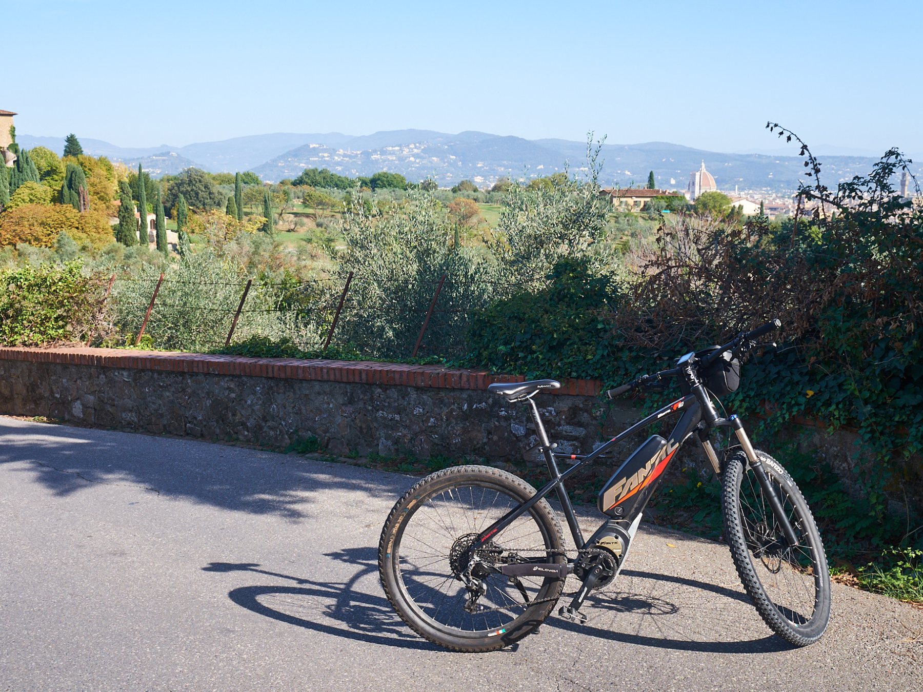 a bicycle parked on the side of the road