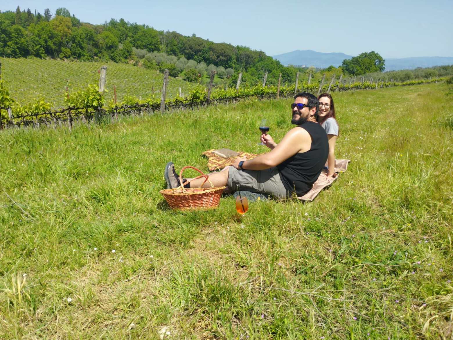 a person sitting on top of a grass covered field