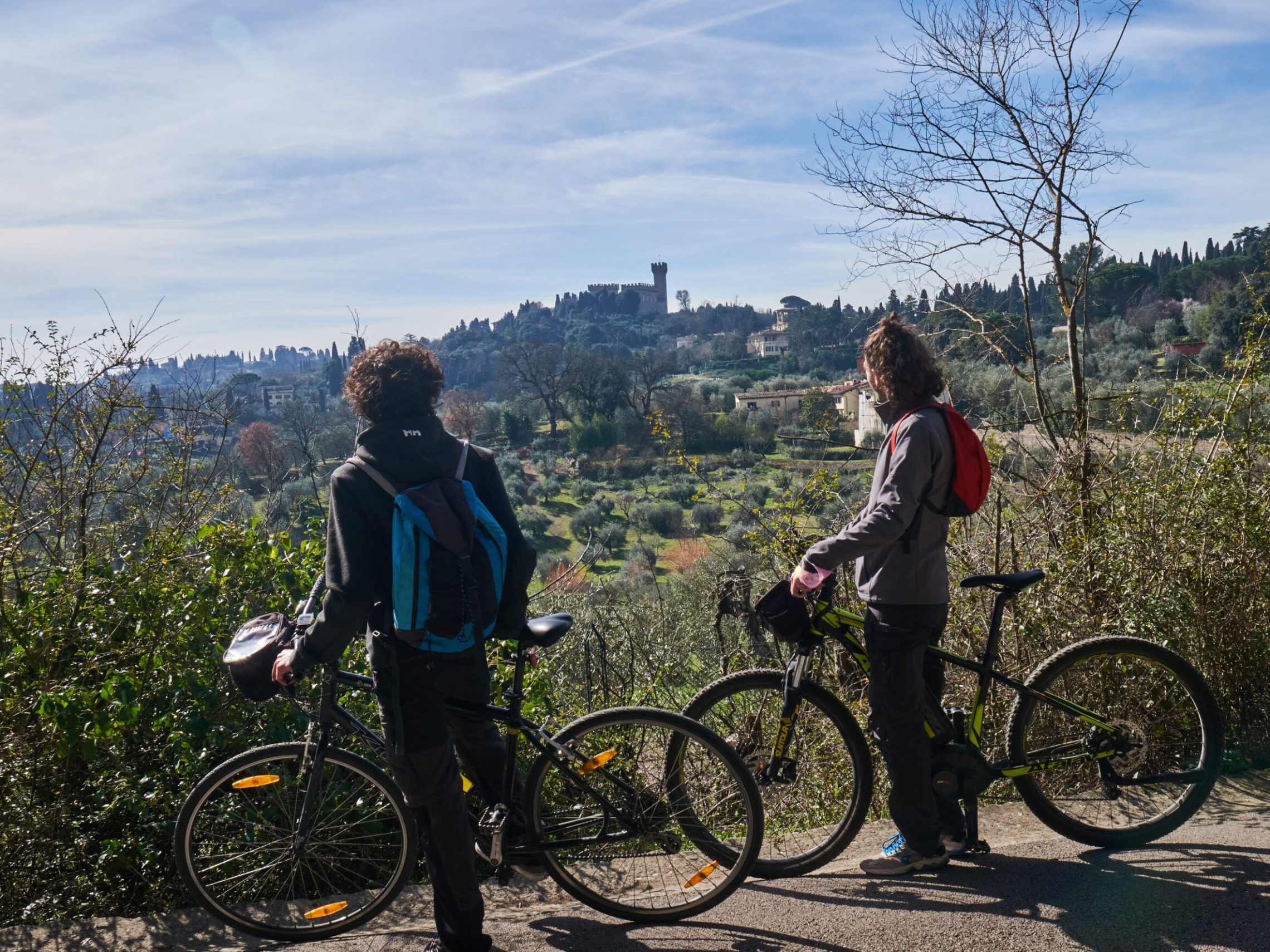 a person standing next to a bicycle