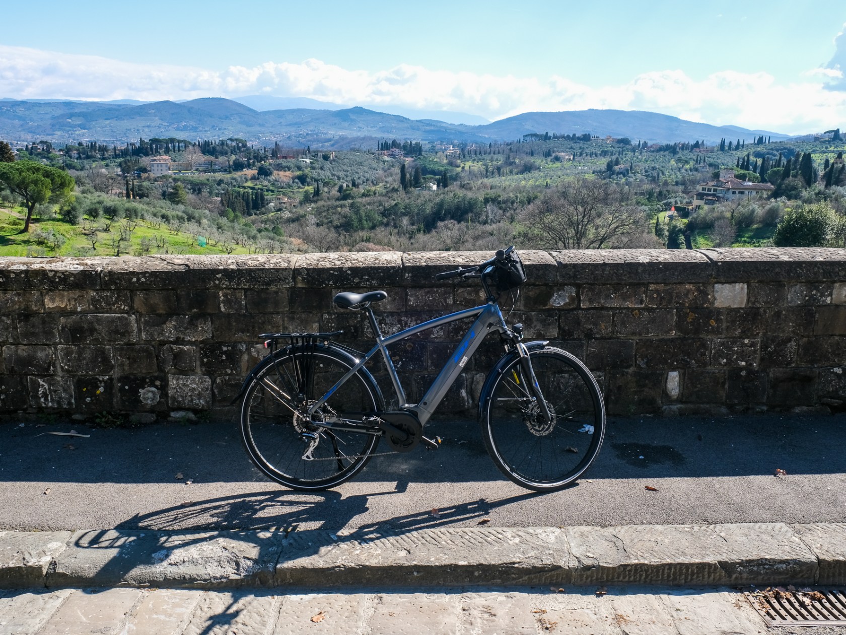 a bicycle parked on the side of a mountain