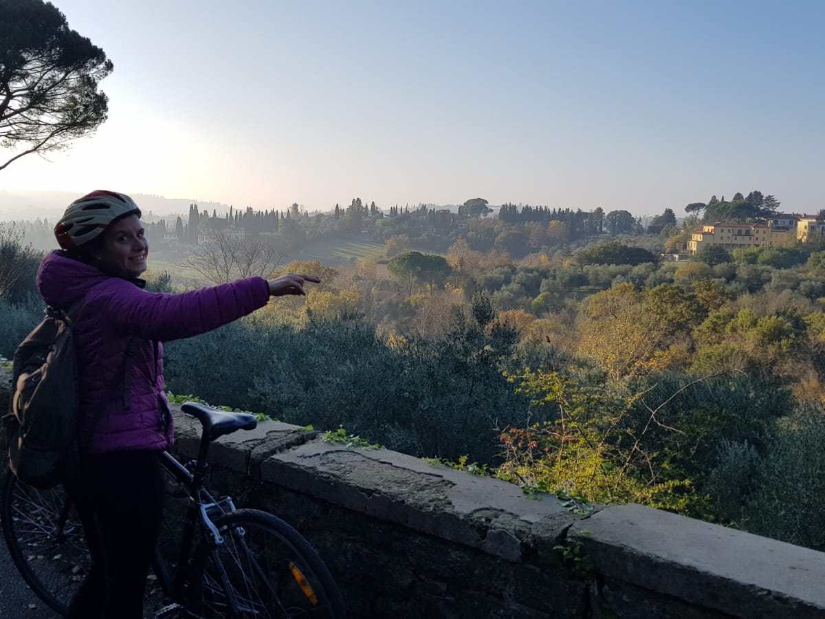 a person riding on the back of a bicycle