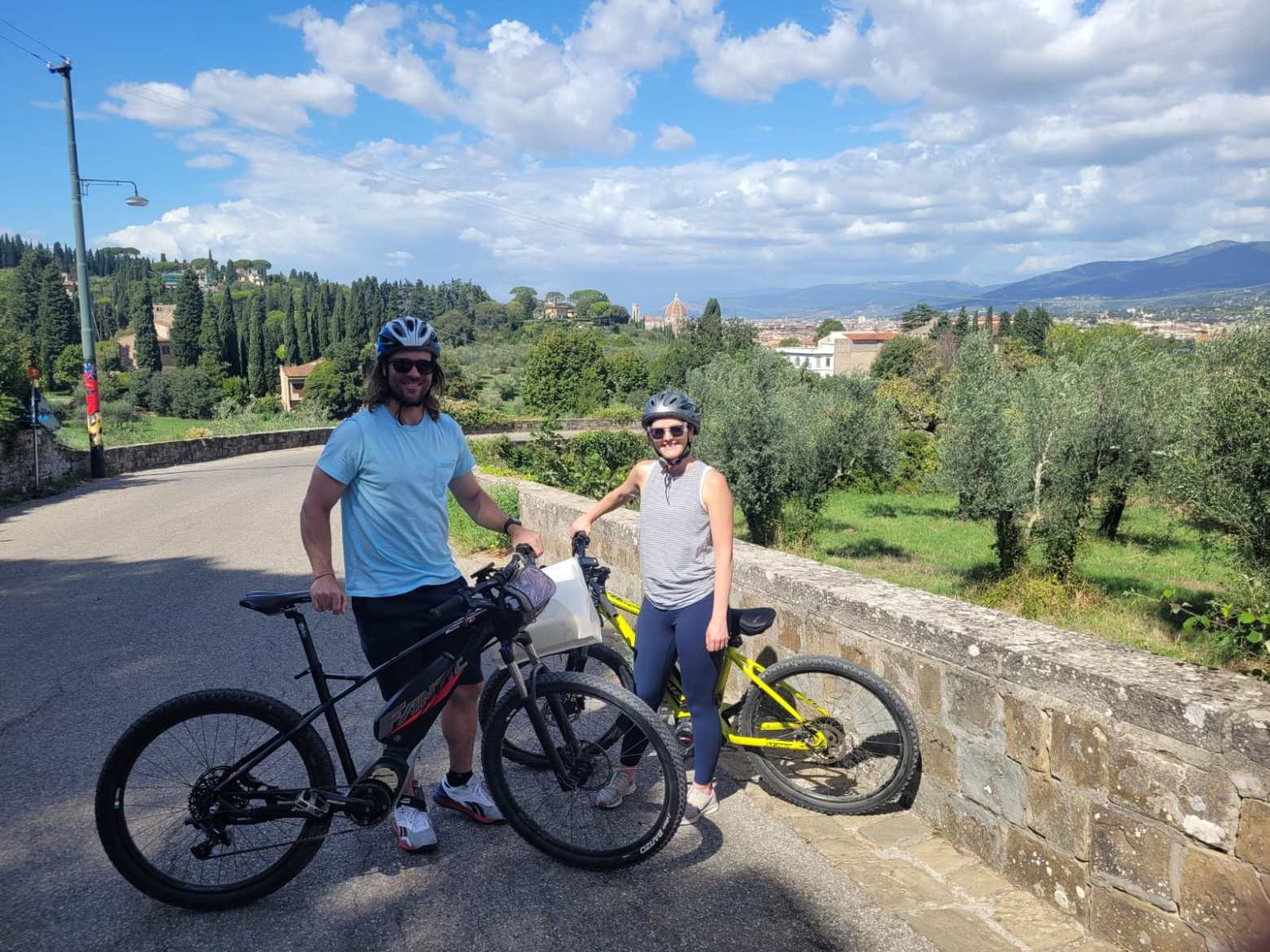 a group of people riding on the back of a bicycle