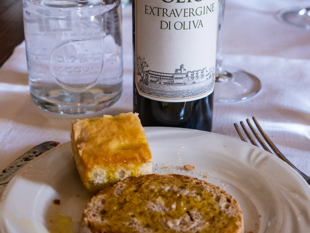 a plate of food and a bottle on a table