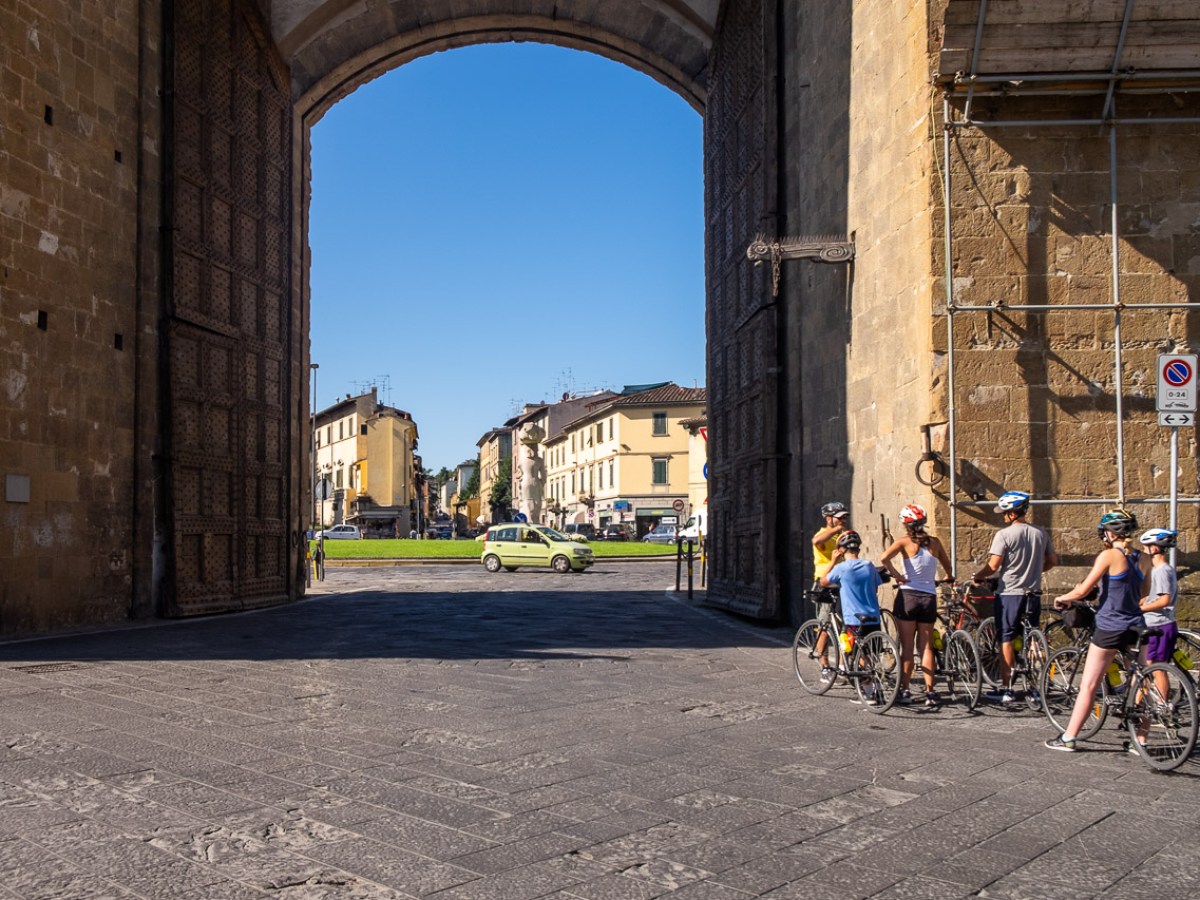 a group of people walking in front of a building