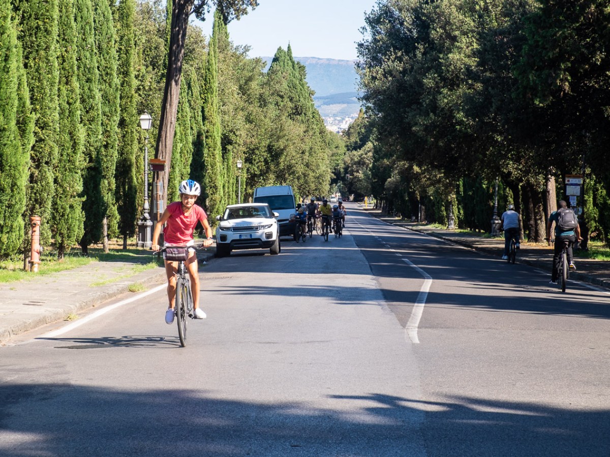a person riding a skateboard up the side of a road