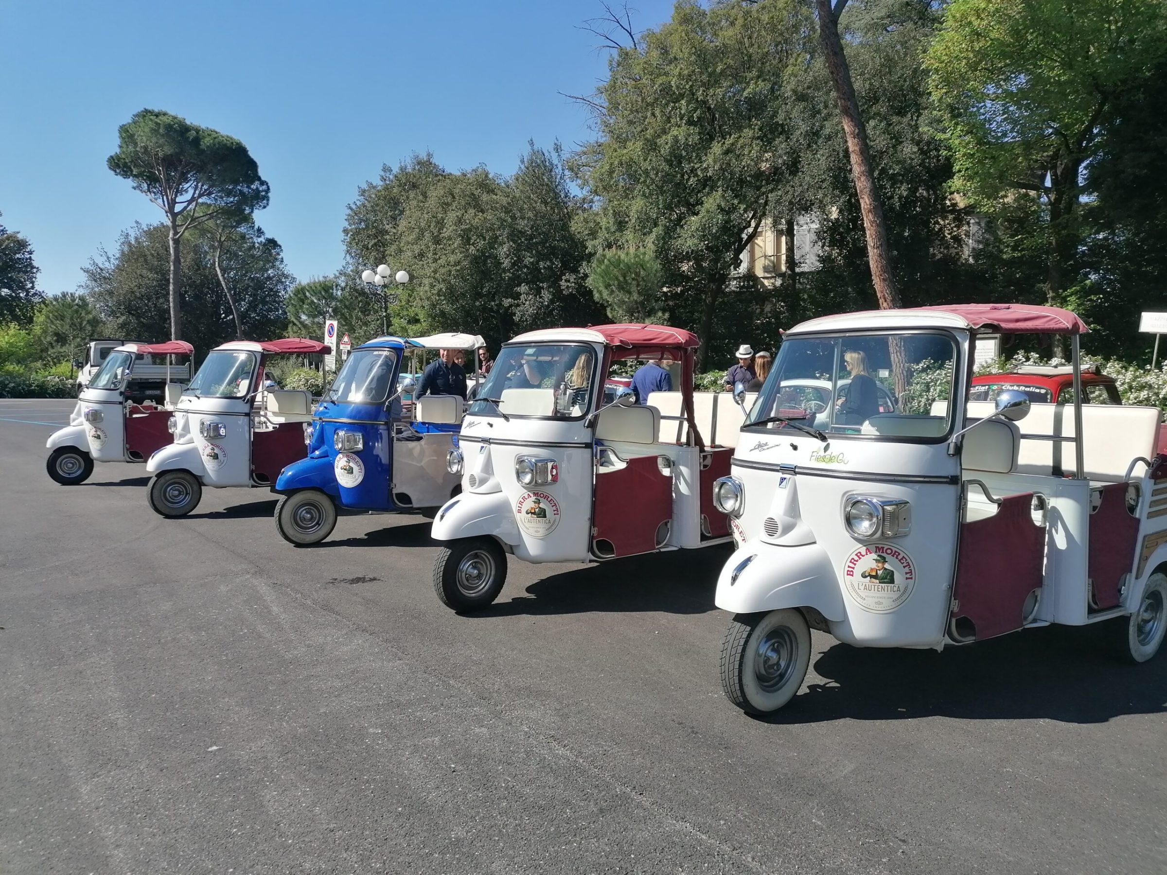 a group of people riding on the back of a truck