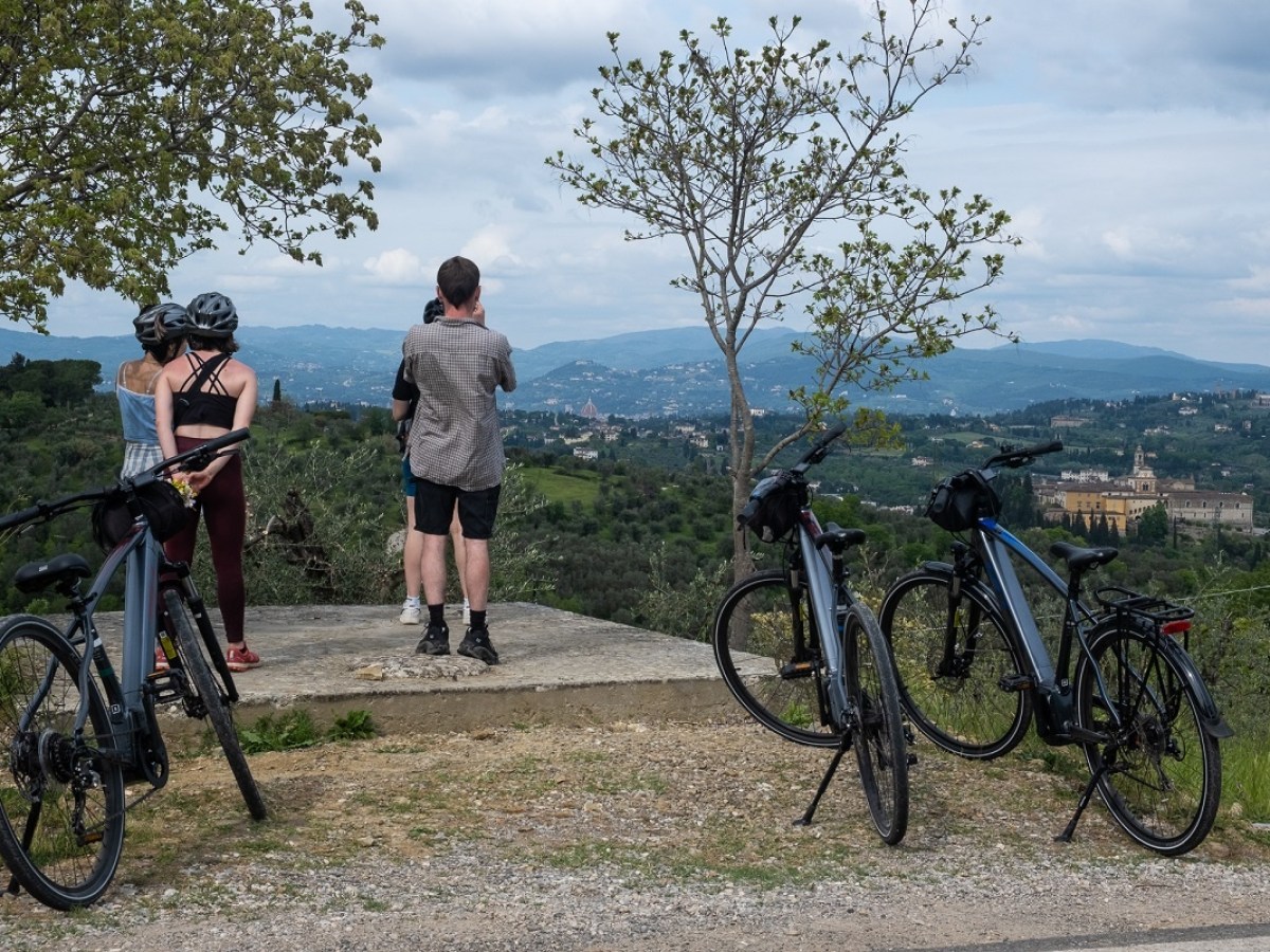 a person standing next to a bicycle