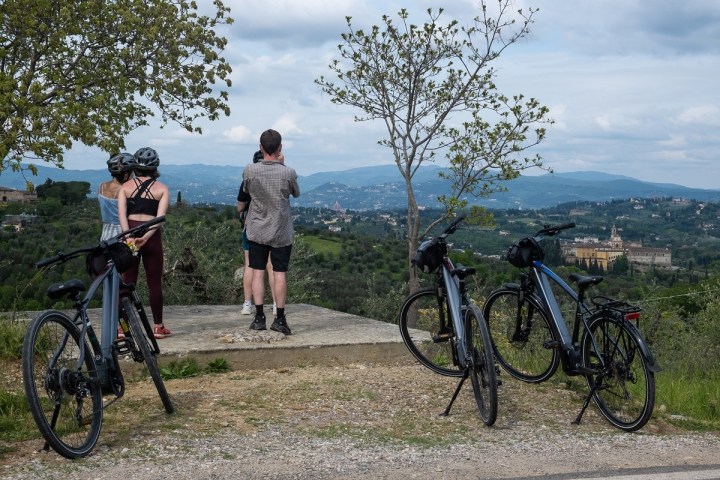 a person standing next to a bicycle