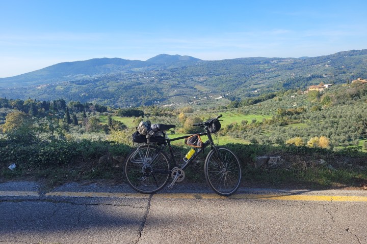 a bicycle parked on the side of a mountain