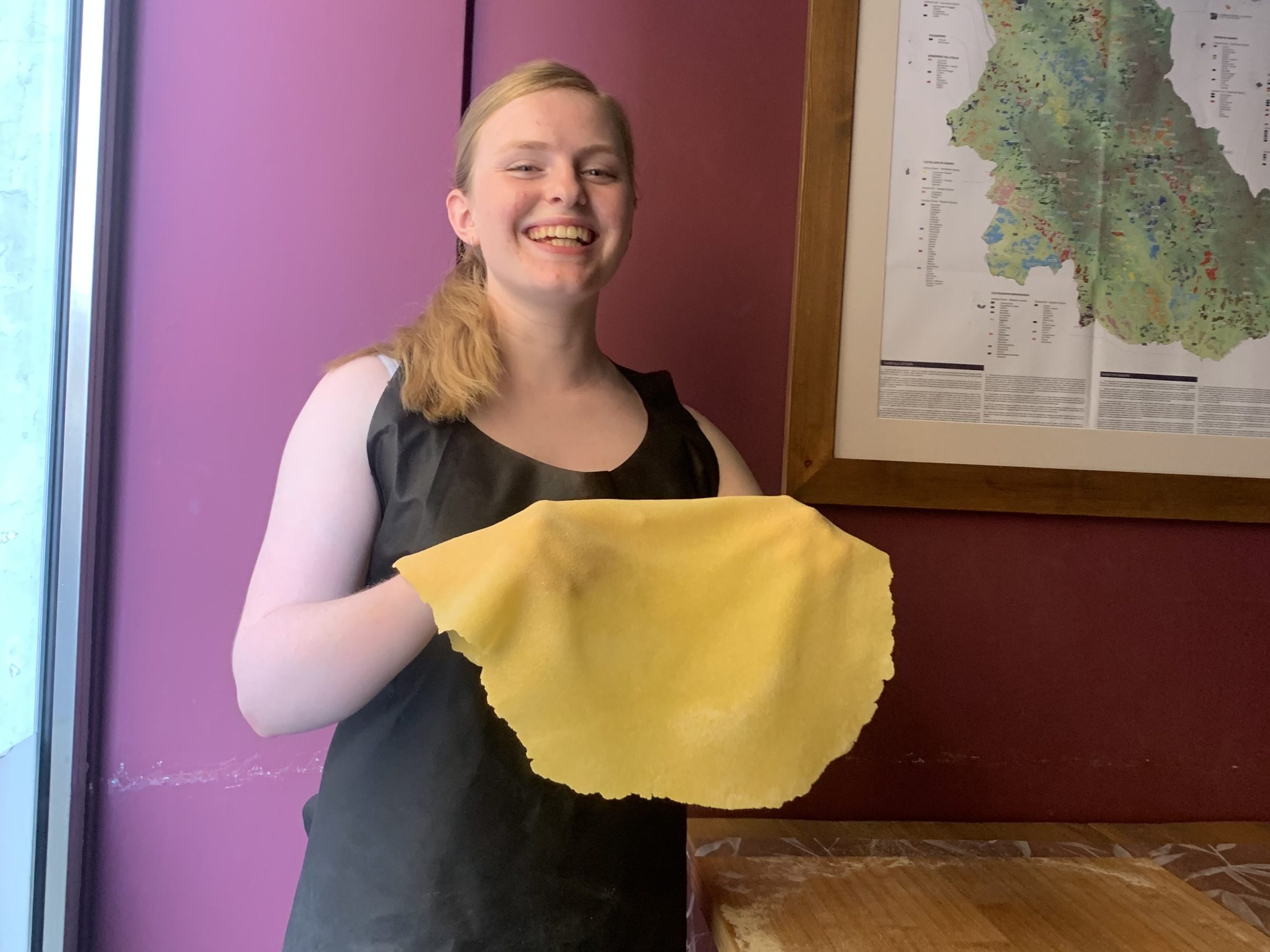 a woman standing in front of a mirror posing for the camera