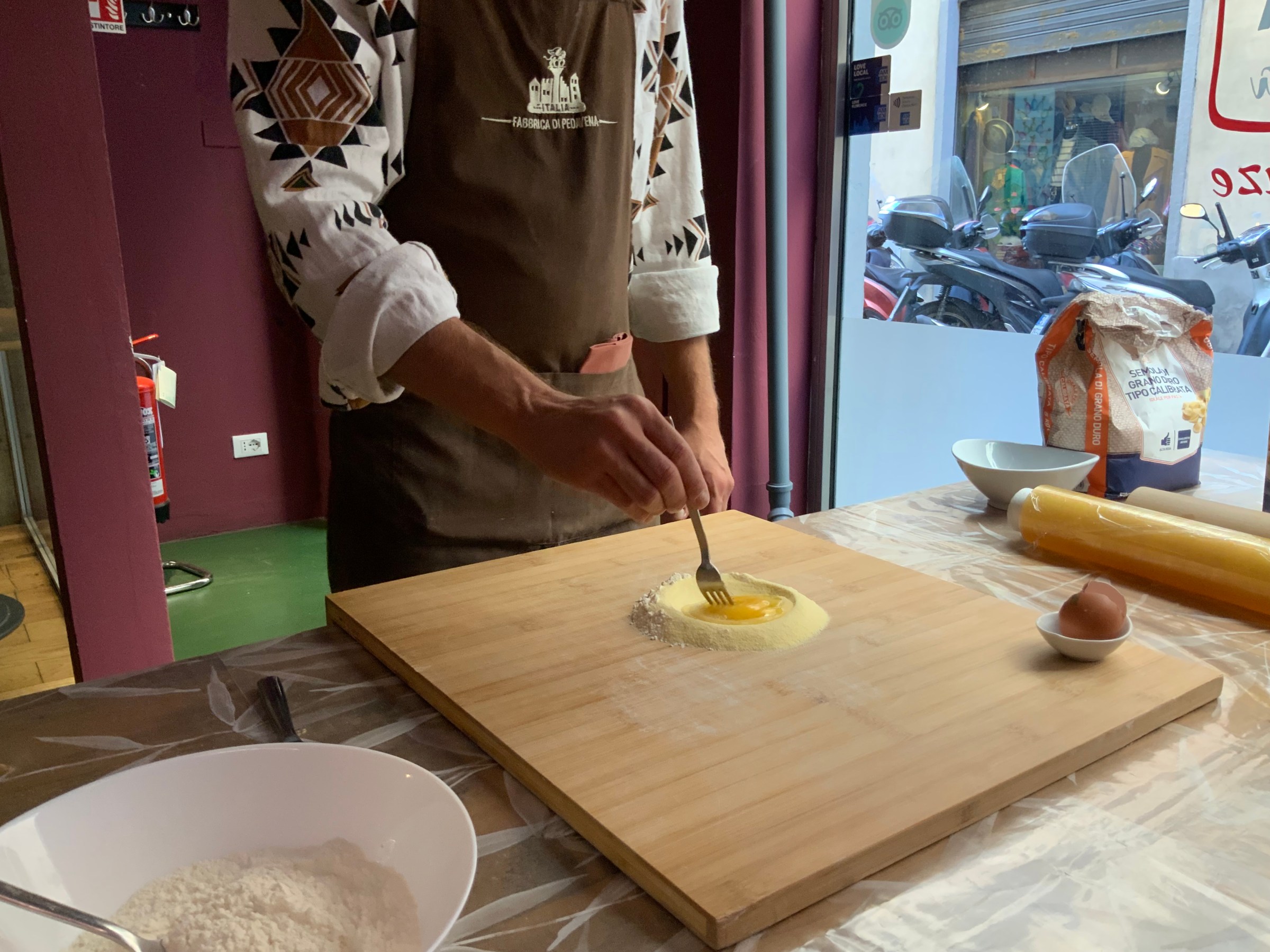 a man cutting food on a table