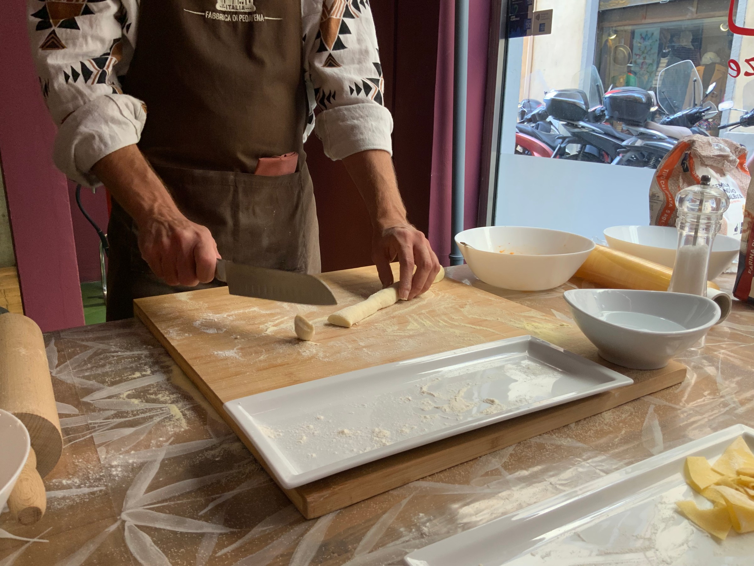 a man cutting food on a table
