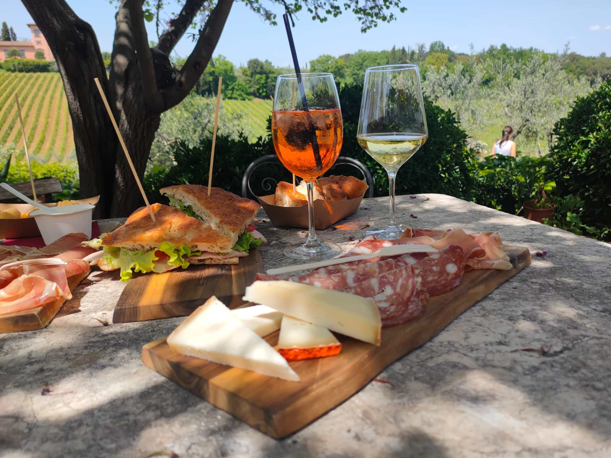 a pizza sitting on top of a picnic table